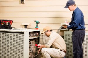 ac-technicians-working-on-ac-unit